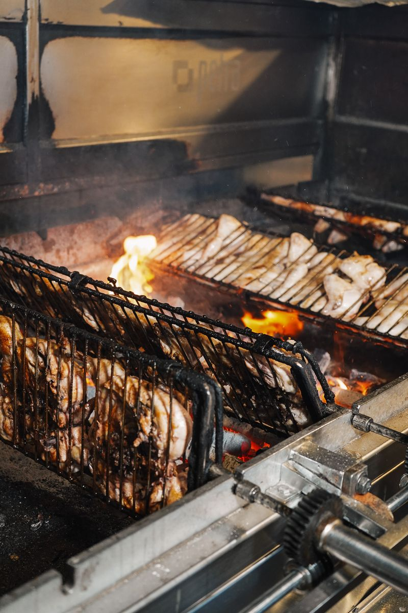 Chicken cooking over live charcoal